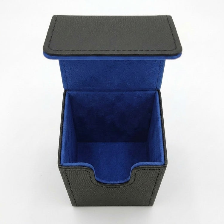 Empty open black deck box with blue lining and a U-shaped front cutout, viewed from above against a white background.