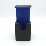 A black faux leather card holder or deck box with an open top, featuring a vibrant blue velvet interior lining.