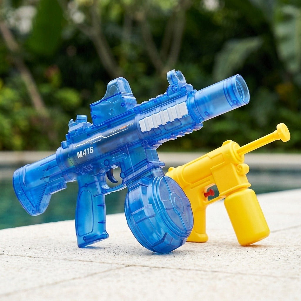 A translucent blue electric water gun stands beside a smaller yellow water gun on pale poolside paving with greenery behind.
