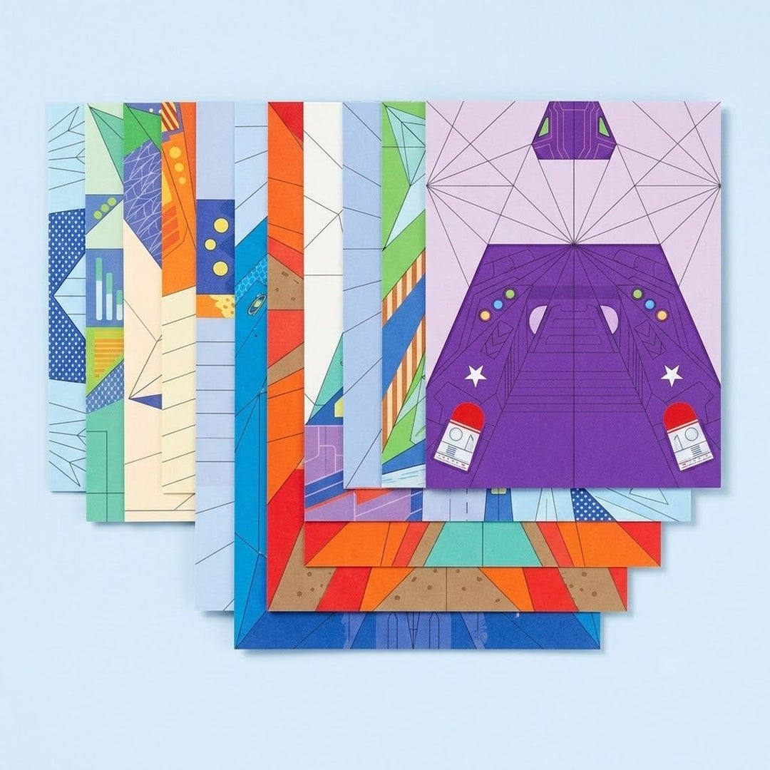 Overlapping origami kit paper sheets display colorful airplane designs and printed folding guides on a pale blue background.