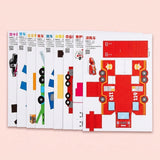 Origami kit with overlapping white paper sheets printed with colorful vehicle templates, including a red fire truck, on a pale pink background.
