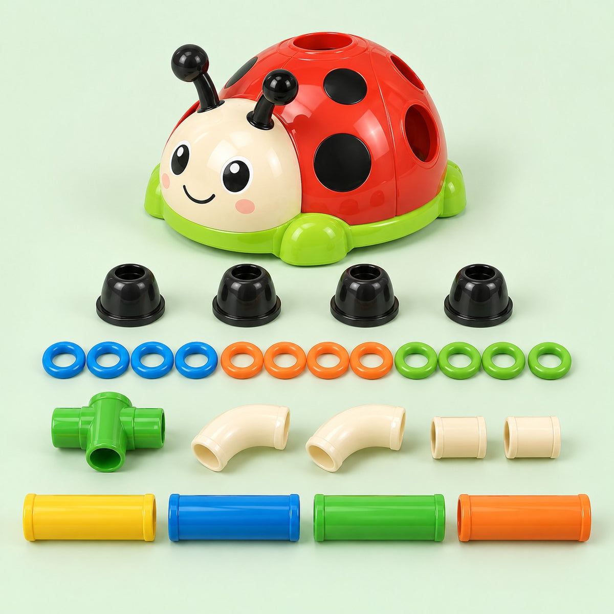 Ladybug Activity Toy Set 2-in-1 pieces, including rings and bar parts, sit on a pale green backdrop.