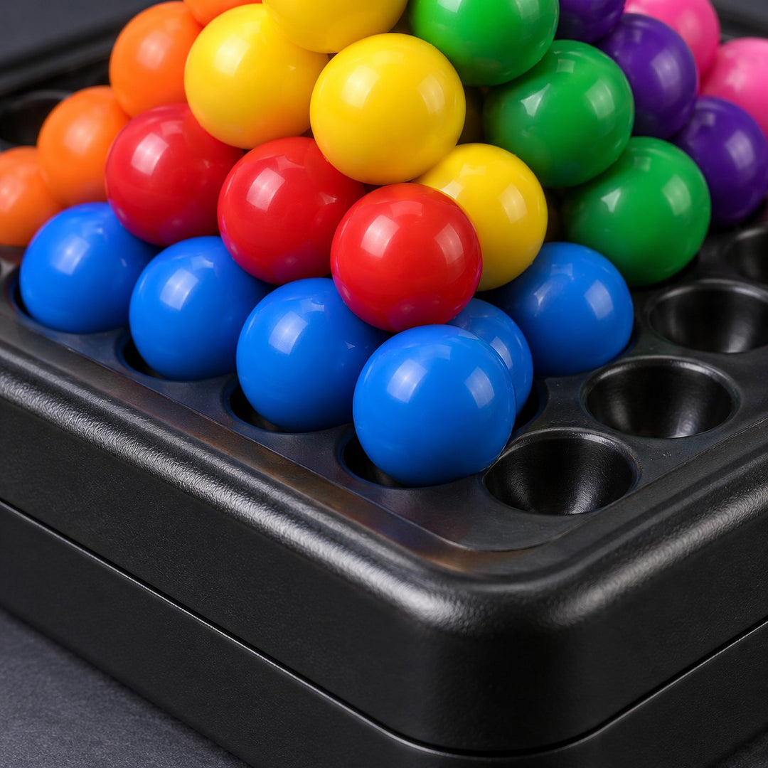 Pyramid Bead Puzzle Game close-up shows glossy beads, molded plastic and round board recesses.