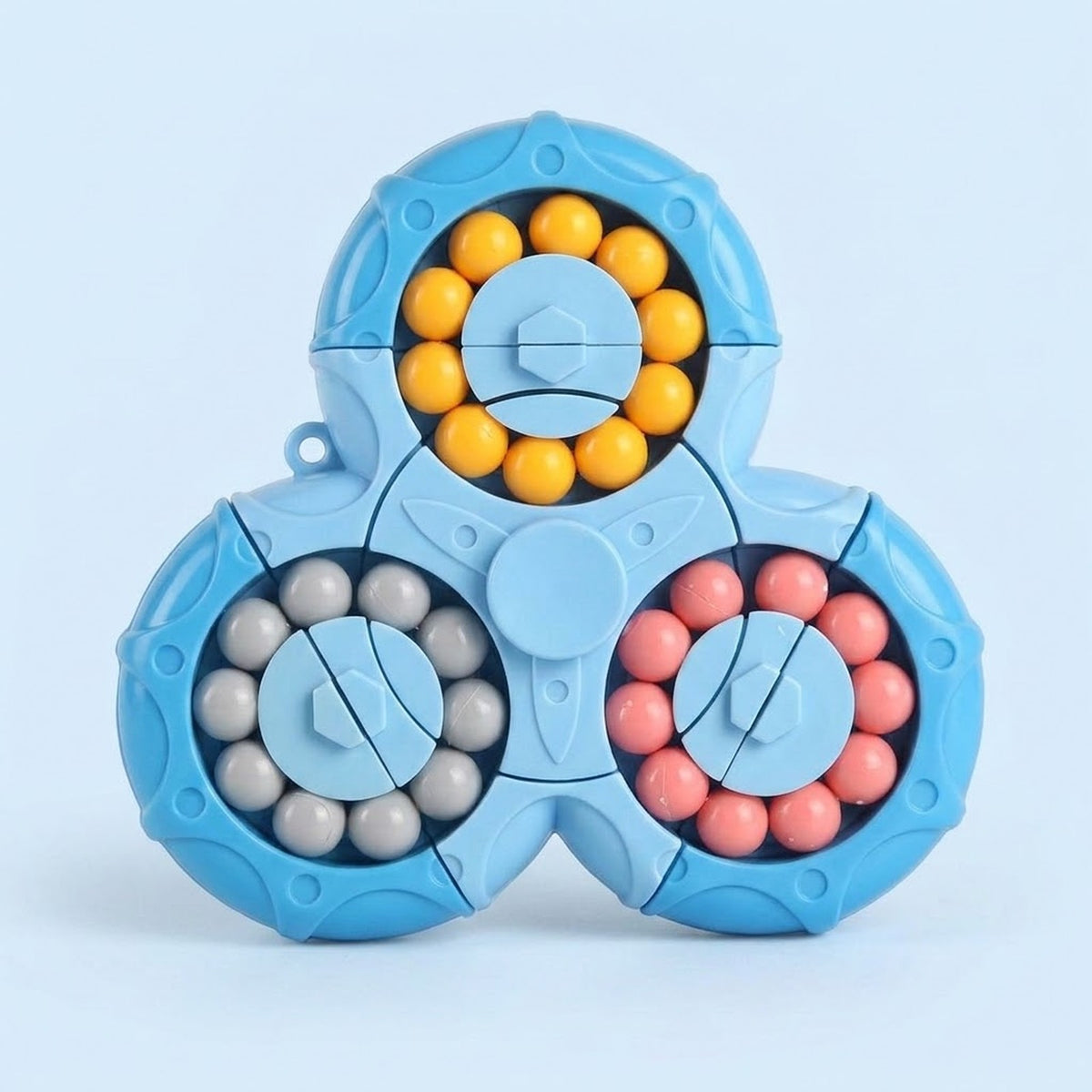 A blue plastic fidget puzzle displays three circular tracks of yellow, grey and pink beads against a pale blue background.