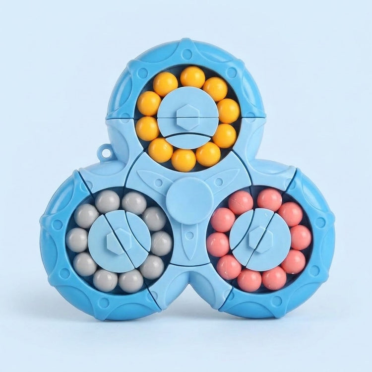A blue plastic fidget puzzle displays three circular tracks of yellow, grey and pink beads against a pale blue background.