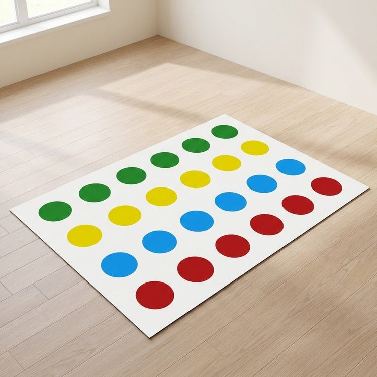 A white party game mat with green, yellow, blue, and red circles lies on pale wooden flooring in a sunlit room.