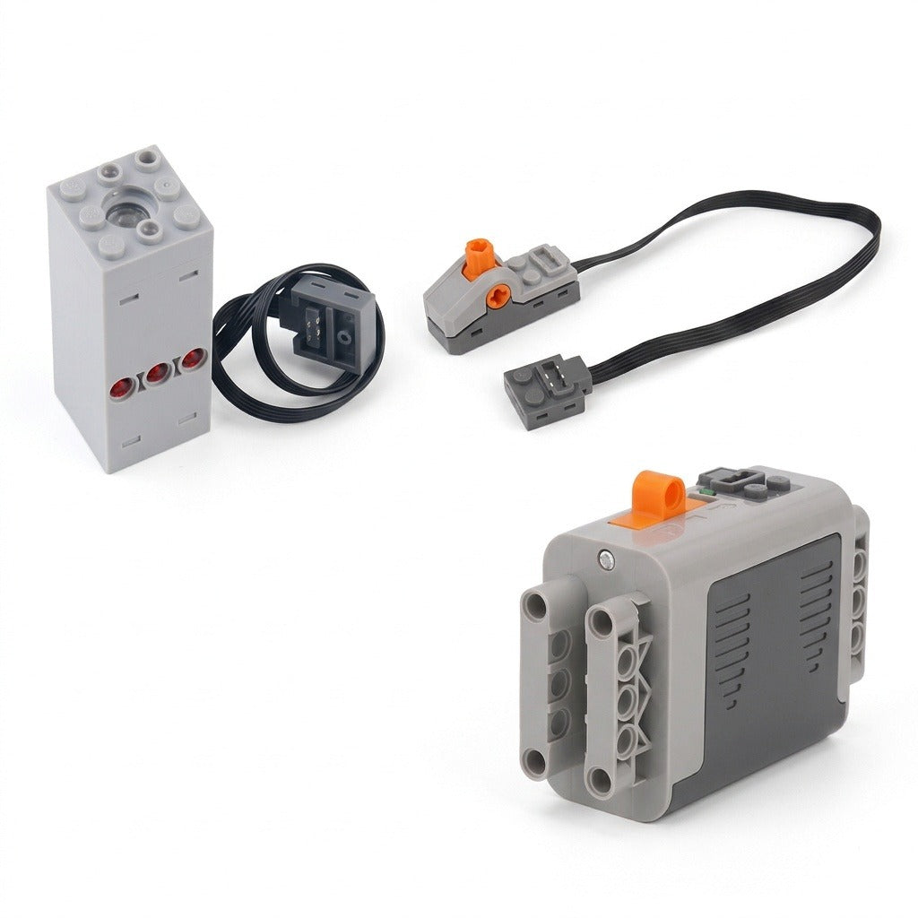 A gray plastic model exhaust sprayer, battery case, orange-accented switch, and black connecting cables are arranged separately on a white background.