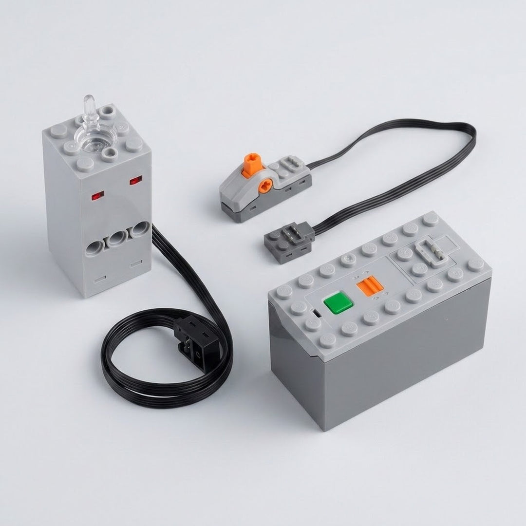 A gray model exhaust sprayer sits beside a battery case with green and orange controls, wired switch, and black cables on white.