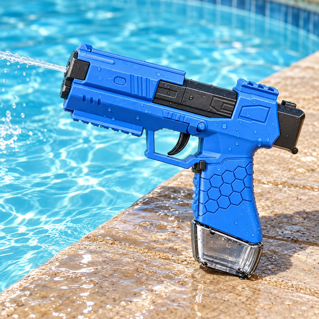 Blue manual water squirt gun rests poolside, ready for an outdoor water-play session.