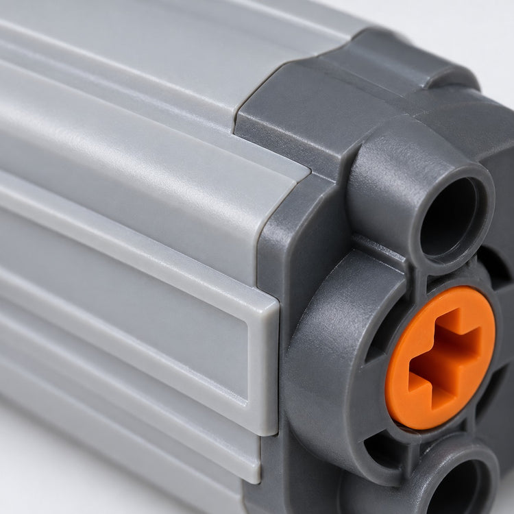 Macro detail shows the molded plastic ribs, dark end cap and orange axle socket.