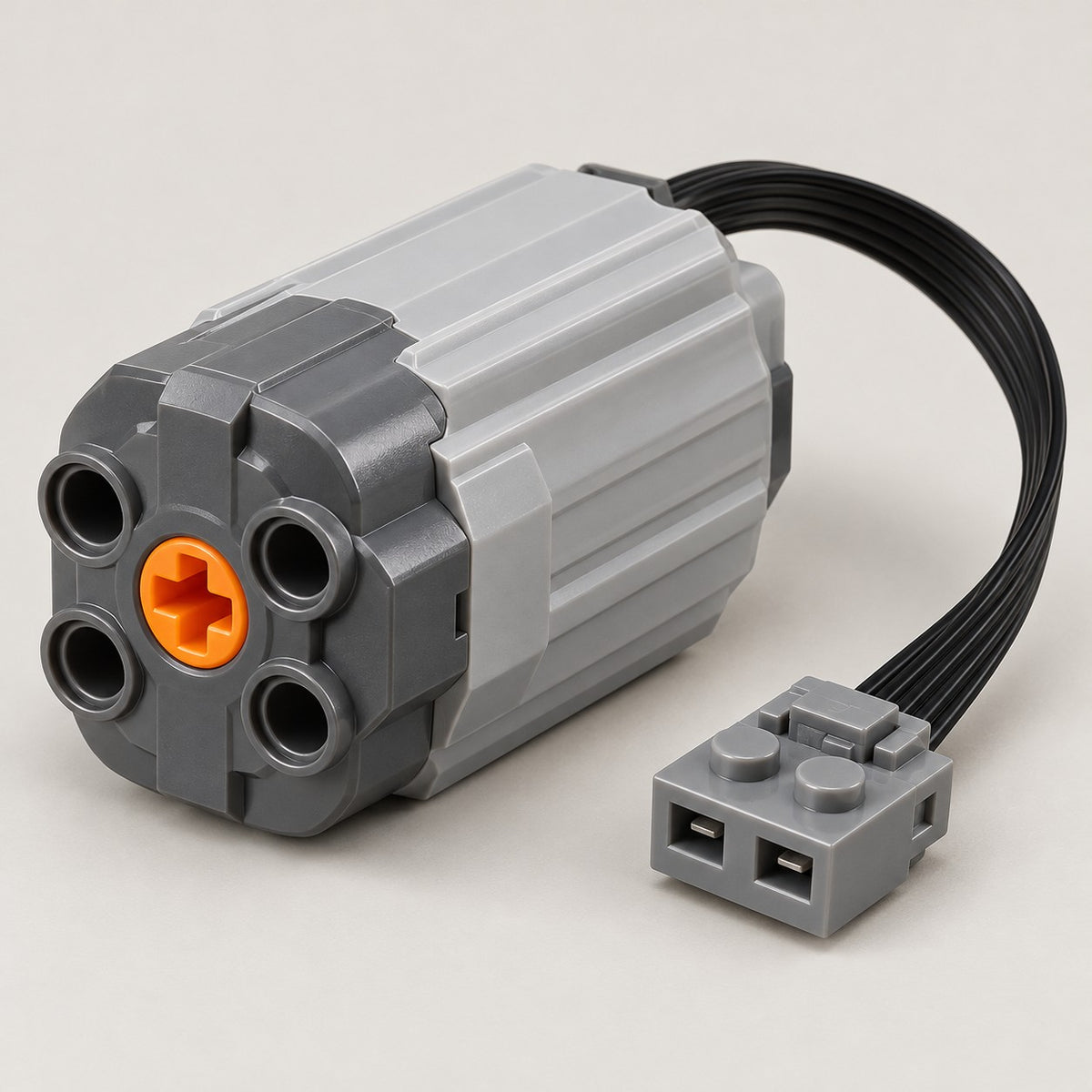 Medium building-block motor shown clearly with its ribbed casing, axle port and cable connector.