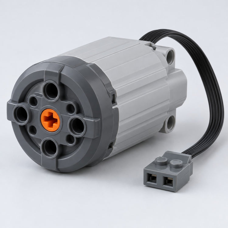 Extra large building-block motor with attached cable on a pale gray studio backdrop.