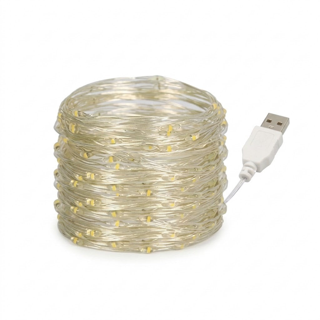 Coiled clear fiber optic string lights with small warm yellow LED bulbs and a white USB connector cable, shown on a plain white background.