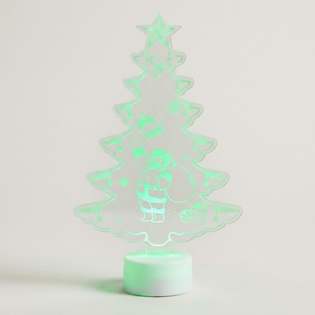 A glowing LED night light shaped like a Christmas tree with a Santa Claus figure, emitting a soft mint green light on a plain light background.