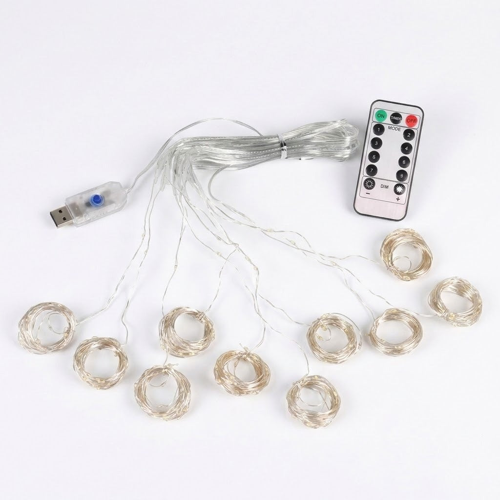 An LED curtain light has coiled clear strands, a connected USB controller and a white remote arranged on a white background.