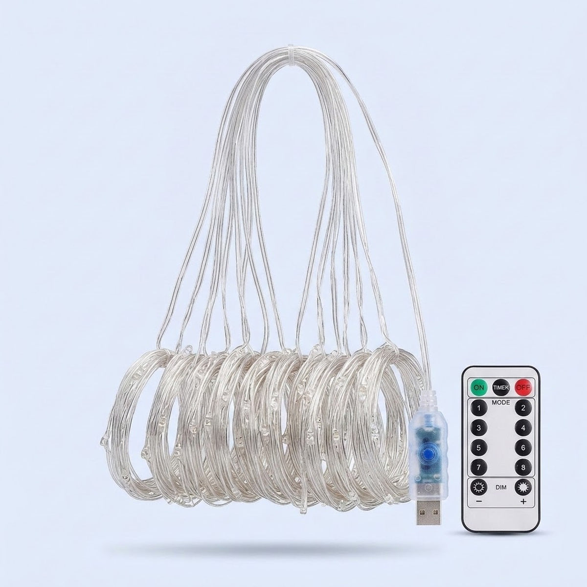 An unlit curtain light has clear strands gathered into hanging coils beside a USB connector and white remote against pale blue.