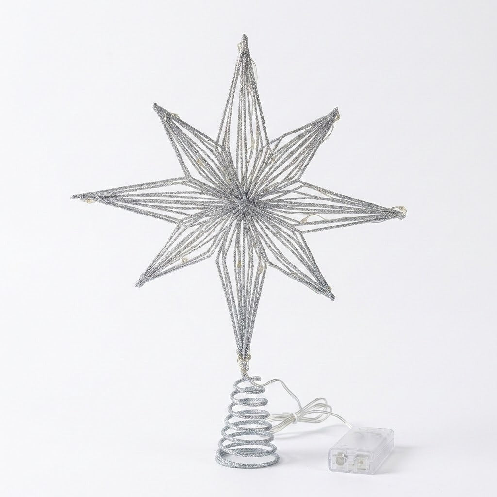 A silver glitter wire star tree topper with a spiral spring base, shown with its clear plastic power adapter on a white background.