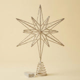 A metallic silver wire star tree topper with a spring base, shown on a solid beige background with a small white box at the bottom.
