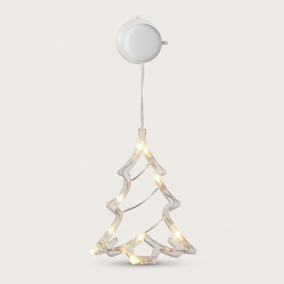 A clear Christmas tree-shaped window light with warm LEDs hangs below a round white housing against an off-white background.