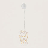 A clear reindeer-shaped window light with warm LEDs hangs beneath a round white housing against an off-white background.