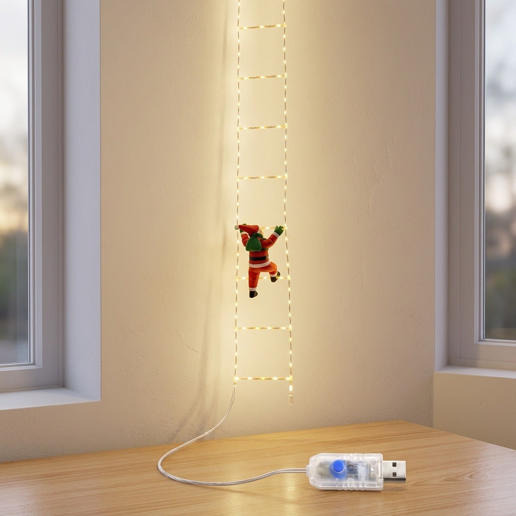 Ladder-shaped Christmas string lights with a red Santa ornament hang between windows, with a USB controller resting on a wooden tabletop.