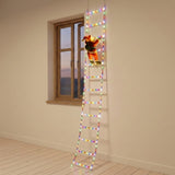 Multicolor Christmas string lights form a ladder with a red Santa figure beside a wooden window against a beige wall.