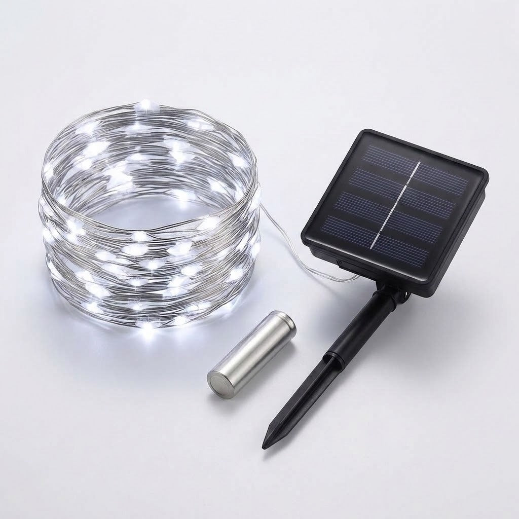 Solar string lights with a coiled wire of glowing white LED bulbs, a small rectangular solar panel stake, and a silver metal battery, shown on a light gray background.