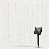 Solar-powered white string curtain lights with a black stake-mounted solar panel, shown against a light gray background.