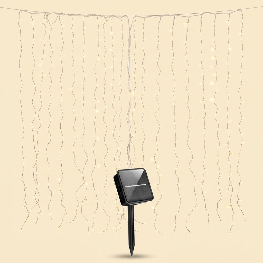 Solar LED curtain light with thin hanging strands and a black solar panel on a pointed stake against a beige background.