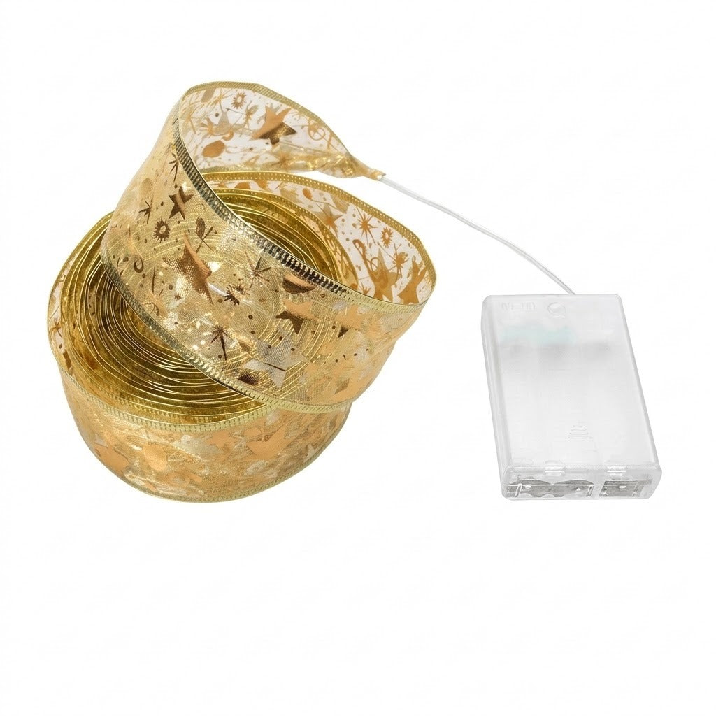 A gold ribbon light string with festive metallic patterns sits coiled beside its connected clear battery box on a white background.