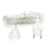 A coiled clear plastic extension cord with a two-pin European plug on one end and a multi-pin plug on the other, shown on a white background.