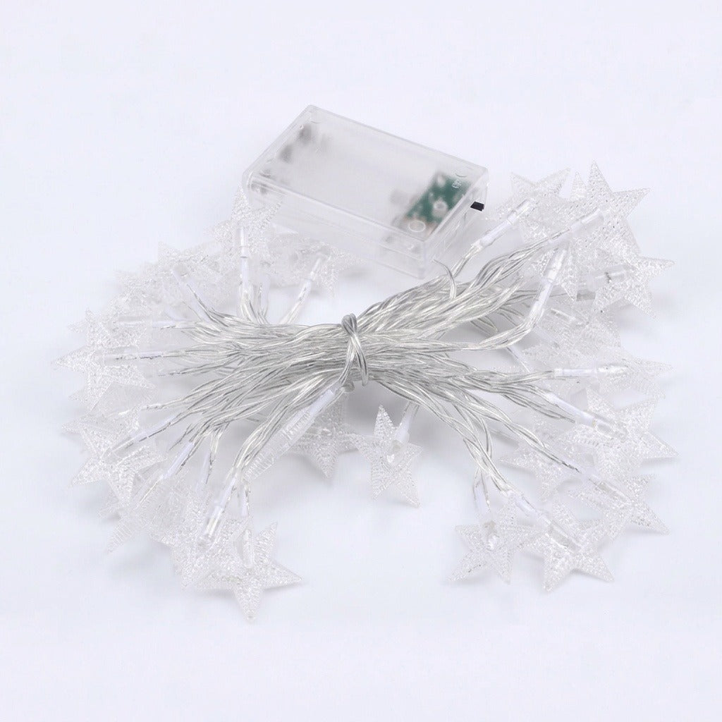 White star-shaped fairy string lights with a clear battery compartment, arranged on a white background.