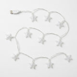 White star-shaped LED fairy string lights with a USB connector, arranged on a plain white background.