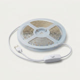 A coiled white LED light strip with a USB connector and inline switch, shown on a clean off-white background.