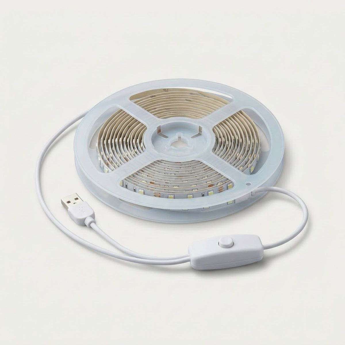 A coiled white LED light strip with a USB connector and inline switch, shown on a clean off-white background.