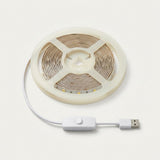 A coiled LED strip light with a white USB cable and inline switch, shown on a clean off-white background.