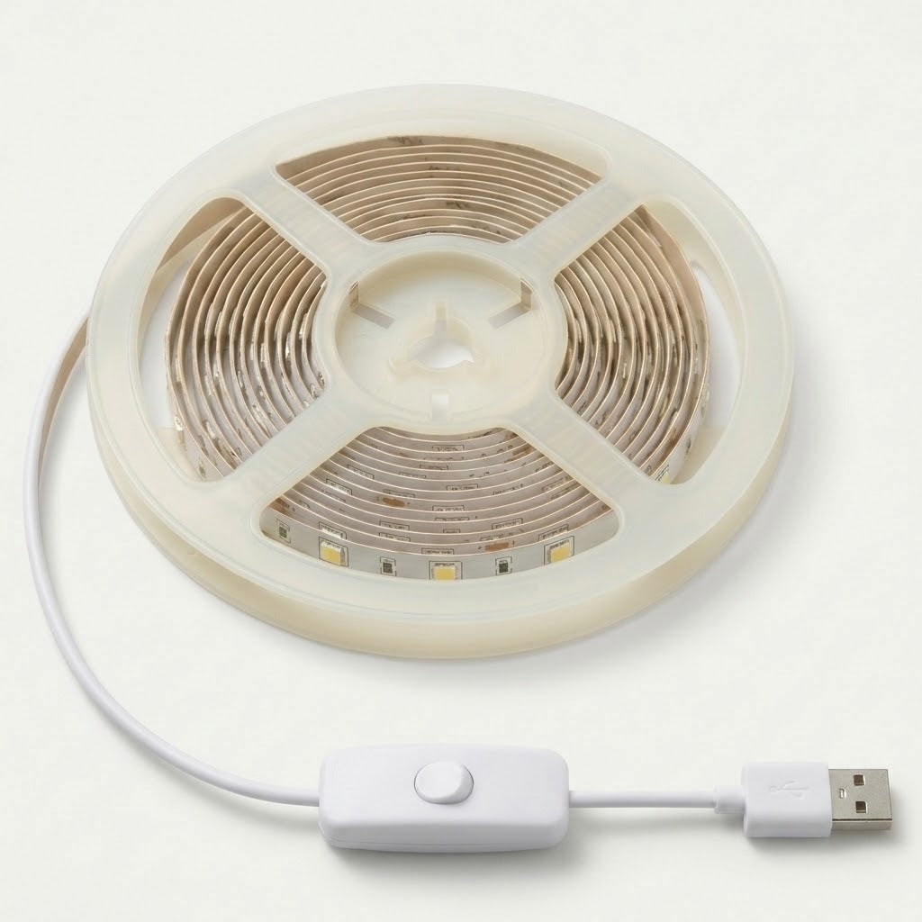 A coiled white LED strip light with a USB connector cable and a white inline switch, shown on a clean off-white background.