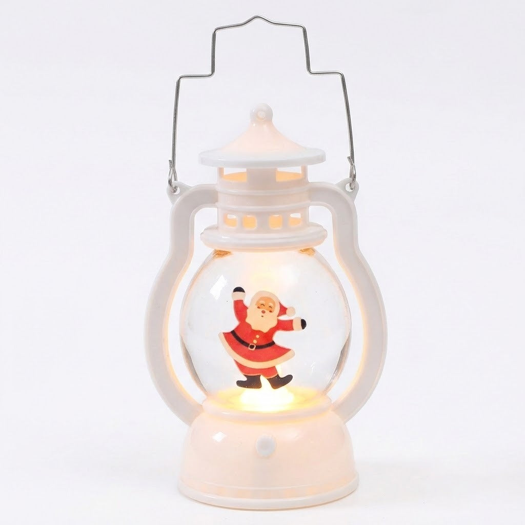 A white plastic decorative lantern with a wire handle and illuminated dancing Santa stands against a plain white background.