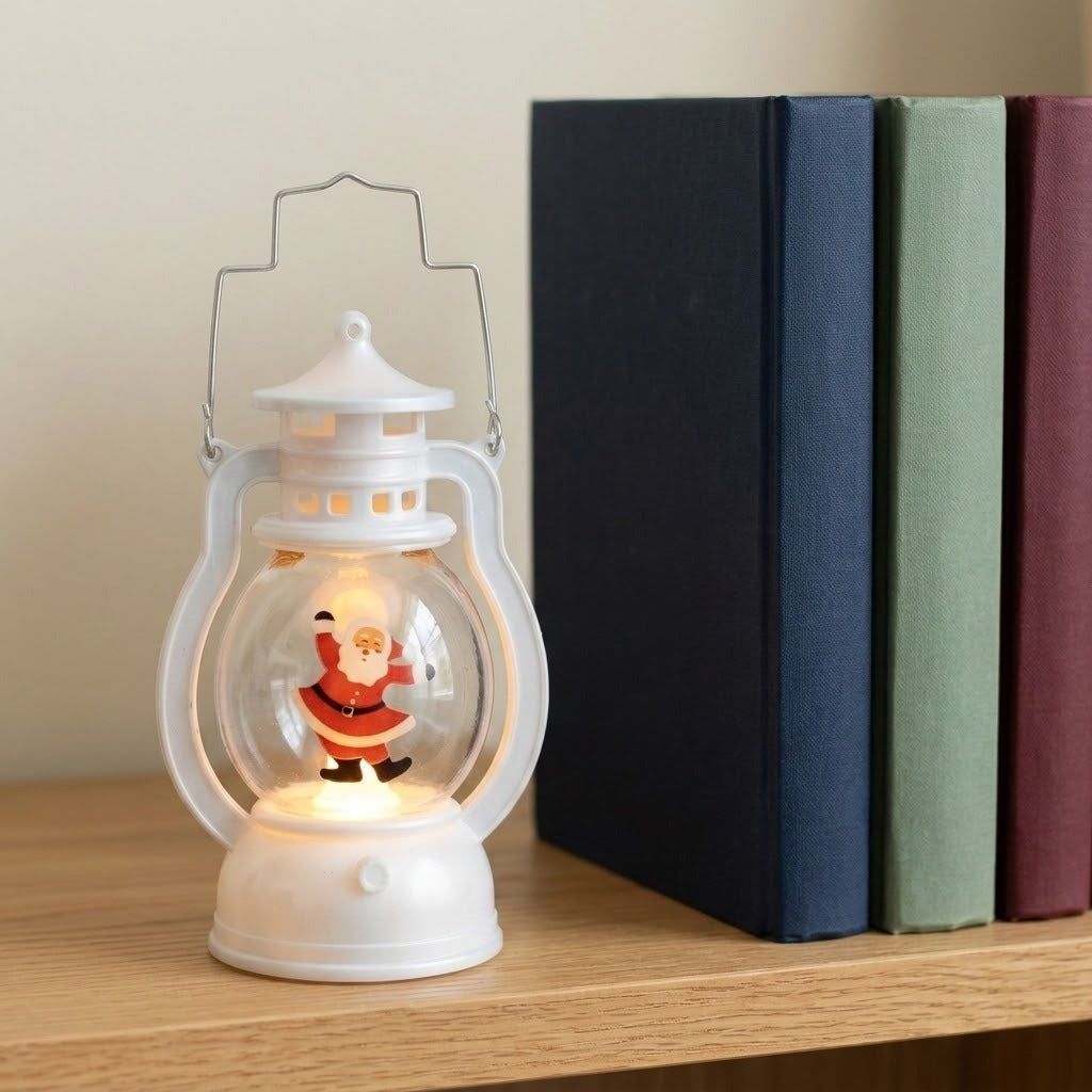 A white decorative lantern with a clear globe and dancing Santa glows on a wooden shelf beside upright books.