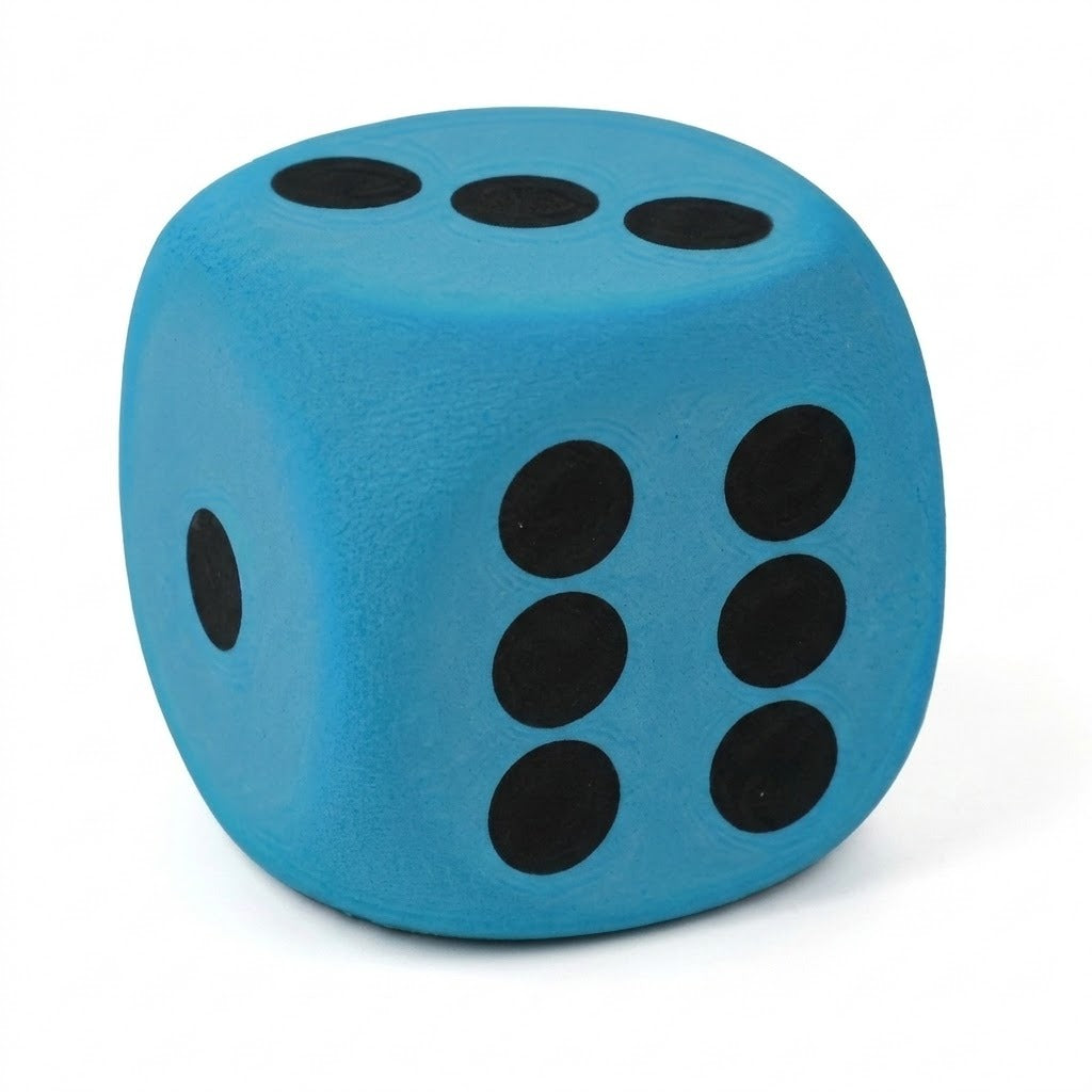 A blue foam die with black dots shows three on top, one on the left, and six on the right against white.