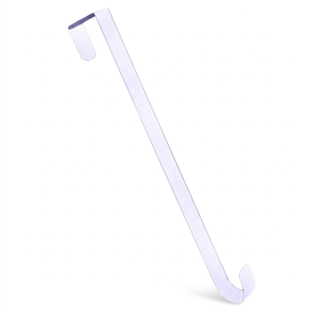 A white zinc alloy wreath hanger lies diagonally against a plain white background, showing its top bracket and curved bottom hook.