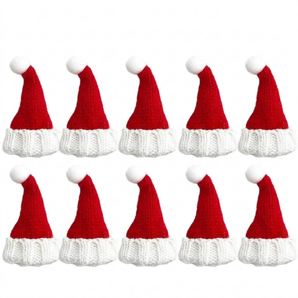 Ten miniature Christmas accessories shaped as red knitted Santa hats with white brims and pom-poms form two rows against a white background.