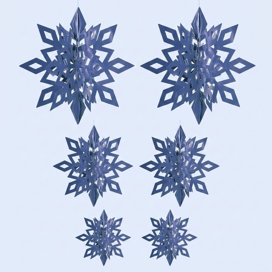 Six metallic blue 3D snowflake ornaments with diamond cutouts hang in three size pairs against a pale blue background.