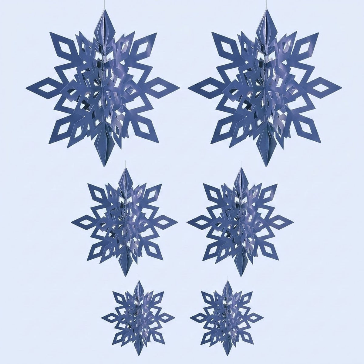 Six metallic blue 3D snowflake ornaments with diamond cutouts hang in three size pairs against a pale blue background.