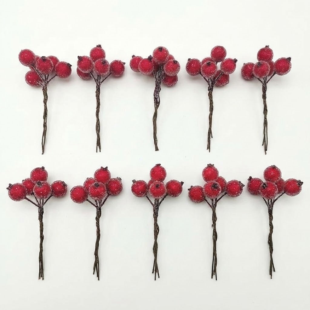Ten red artificial berry picks with twisted brown stems are arranged in two rows of five on a white background.