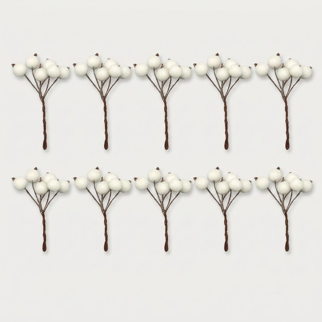 Ten artificial white berry picks with brown stems are arranged in two rows of five on a light gray background.