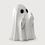 A white ghost figurine with black circular eyes and raised middle fingers, standing on a light gray background.