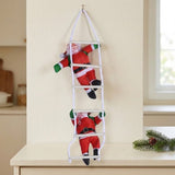 Hanging Christmas decoration with two red Santas on a white ladder against a cream wall above a cabinet.