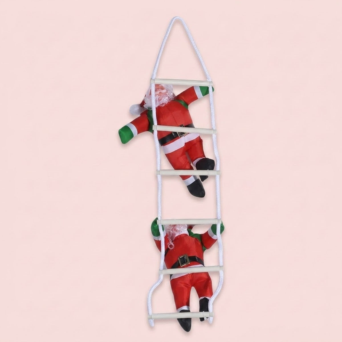A hanging Christmas decoration features two red Santas with green mittens on a white rope ladder against a pale pink background.