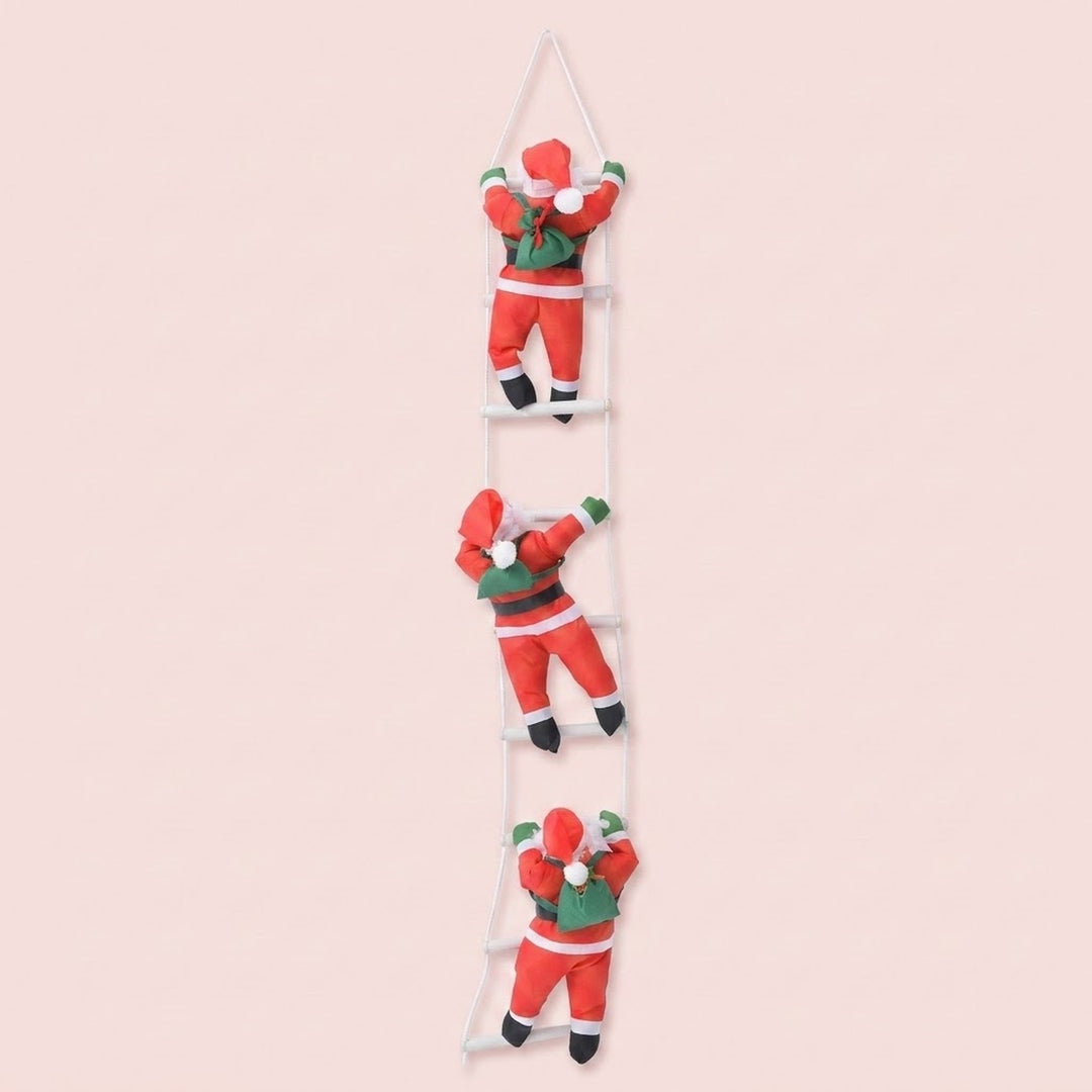Three hanging Christmas decorations shaped like Santa Claus climbing a ladder, shown against a solid pale pink background.
